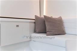 Luxurious interior of 2024 VanDutch 40 yacht with plush cushions and sleek design.