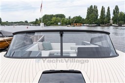 2024 VanDutch 40 yacht with sleek design on a serene river backdrop.