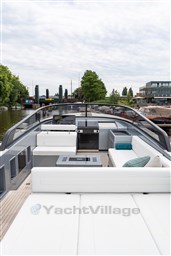 2024 VanDutch 40 yacht with sleek design, spacious deck, and modern amenities on a calm waterway.