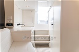 Luxurious interior of 2024 VanDutch 40 yacht featuring sleek white design and modern amenities.