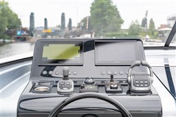 Control panel of 2024 VanDutch 40 yacht with navigation screens and controls.