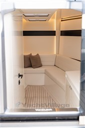2024 VanDutch 40 interior with sleek white seating and modern lighting.