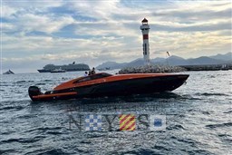 Orange Albatro EVO 45 boat near lighthouse, 2020 model, with cruise ships in the background.