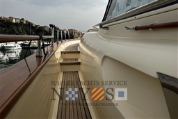 2007 Fratelli Aprea 50 yacht deck with wooden finish, docked near scenic coastline.