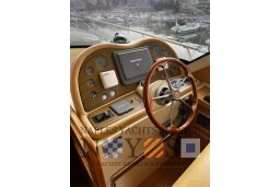 Helm of 2007 Fratelli Aprea 50 yacht with wooden steering wheel and navigation instruments.