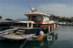 Luxury 2007 Fratelli Aprea 50 yacht docked in scenic marina setting.