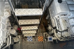 Engine room of 2007 Fratelli Aprea 50 boat with metal stairs and machinery.