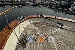 Fratelli Aprea 50 yacht deck, 2007 model, with wooden finish and mooring ropes in harbor.