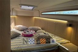 Luxurious cabin interior of 2020 Magazzu MX 13 Gran Coupè with cozy bedding.
