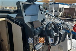 Control panel of 2020 Magazzu MX 13 Gran Coupè yacht, featuring modern navigation equipment.