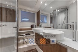 Luxurious bathroom in 2024 Itama 62 RS yacht with modern fixtures and elegant design.