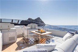 Luxurious 2024 Itama 62 RS yacht interior with ocean view and refreshments.