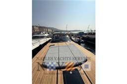 2024 Itama 62 RS yacht docked, featuring sleek design and spacious deck.