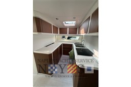 Luxurious kitchen interior of 2024 Itama 62 RS yacht with modern cabinetry and appliances.
