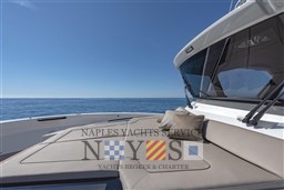 Luxurious 2022 Bluegame BG 42 yacht with sunbathing deck and ocean view.