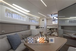 Luxurious interior of 2022 Bluegame BG 42 yacht with modern seating and elegant decor.