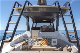 2022 Bluegame BG 42 yacht interior with seating, table, and ocean view.