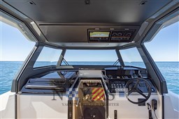 2022 Bluegame BG 42 yacht cockpit with modern controls and ocean view.